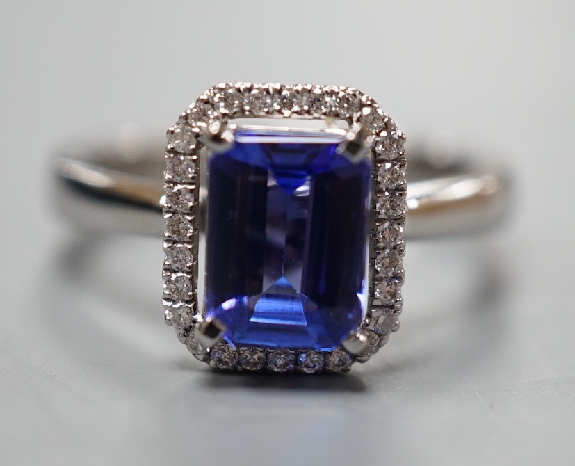 A modern 18k white metal, tanzanite and diamond set rectangular cluster dress ring, size M, gross weight 5 grams